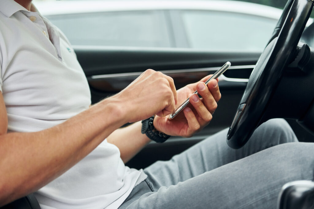 Man texting while driving